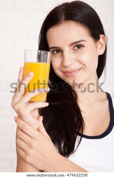 Woman Drinking Orange Juice Smiling Showing Stock Photo 479632258