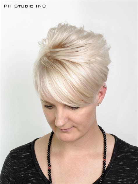 trendy fringe short pixie haircut with undercut and champagne pastel blonde color color