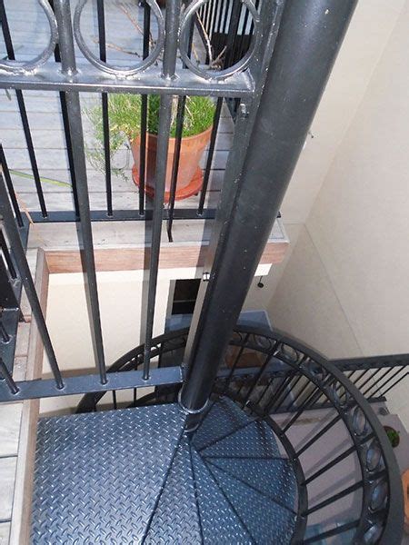 Black alternating tread stairs by brocks metalworks. Compact spiral staircase | Floor fan, Spiral staircase ...