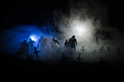Silhouette Of Zombies Walking Over Cemetery In Night Horror Halloween