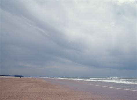 beach blue clouds gray pink sand sea sky waves hd wallpaper