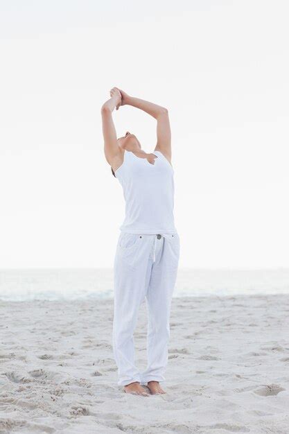 Premium Photo Active Woman Practicing Yoga On The Beach