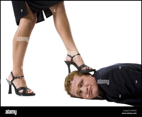 Woman Stepping On Man S Face With Heels Stock Photo Alamy