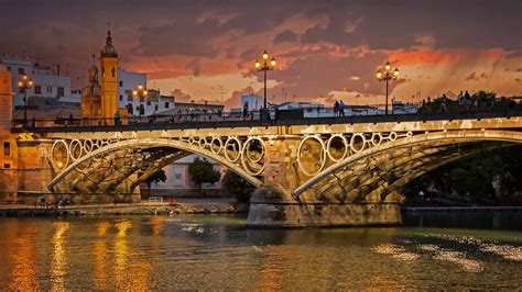 Seville Spains Guadalquivir River And Triana Bridge For The 500th