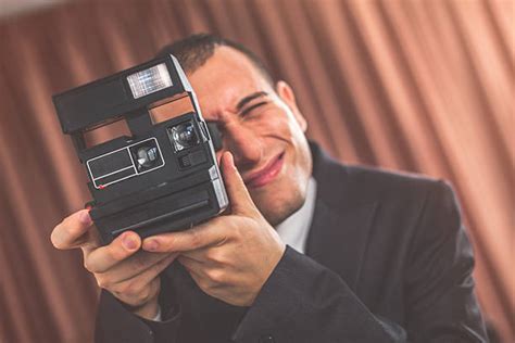 Man Takes Picture With Old Polaroid Camera Stock Photos Pictures