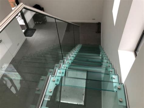 This Is A Modern Straight Flight Staircase Featuring A Glass Balustrade