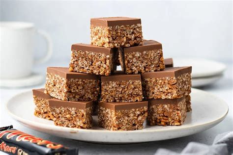 A White Plate Topped With Chocolate And Granola Bars