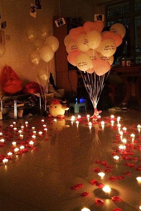 A Room With Candles And Balloons On The Floor