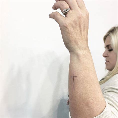 Minimalist Christian Cross Tattoo On The Forearm
