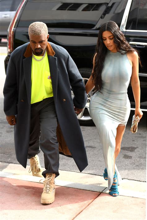 kim kardashian and kanye west hold hands while shopping together during miami trip