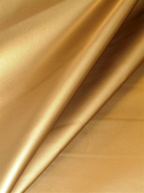 Pattern Tin Man Color Gold Metallic Vinyl Upholstery Fabric