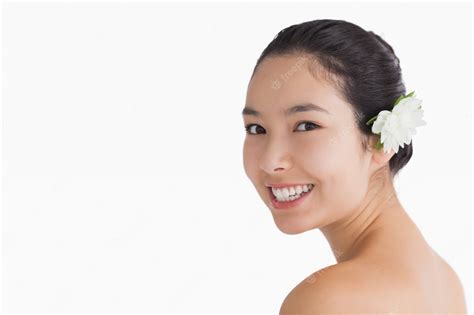 Premium Photo Black Haired Woman Wearing A Flower In Her Hair