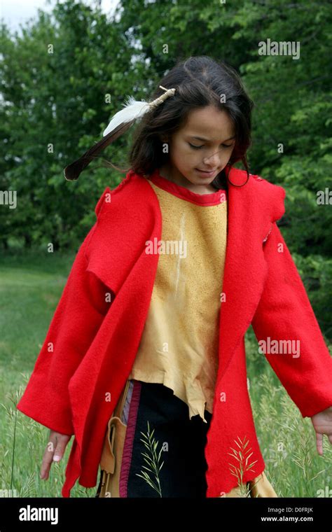 A Native American Indian Boy Lakota Sioux Walking Through The Grass