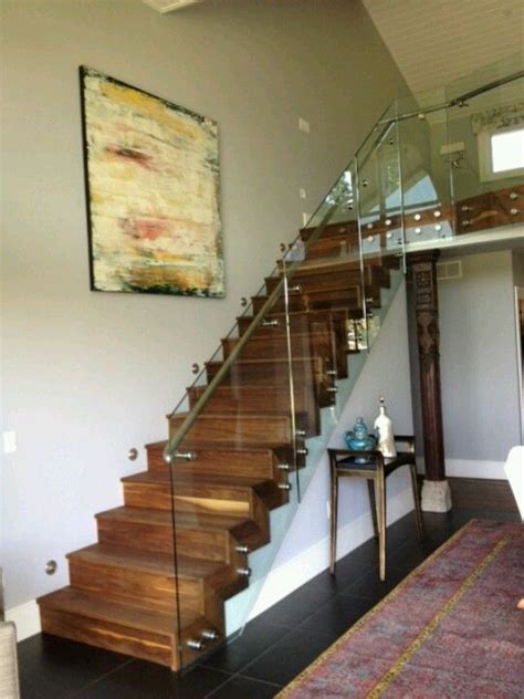 Closed Riser Staircase With Attached Glass Sheet Railing