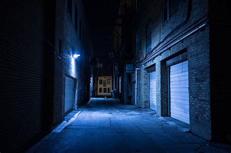Dark And Eerie Urban City Alley At Night Stock Photo Download Image