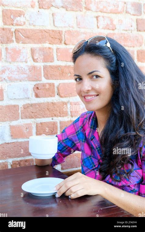 Young Brazilian Latin American Latina Woman 20 To 29 Years Old Drinking Coffee In A Rio