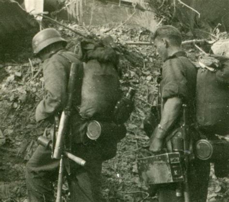 German Soldiers Advancing Through Debris Belgium Or Holland 1940