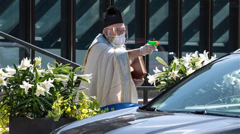 Priest Going Viral After Pictured Using Squirt Gun Filled With Holy