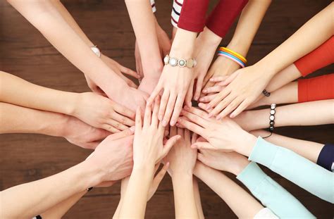 Group Of People Hands Together On Wooden Background Ecarf