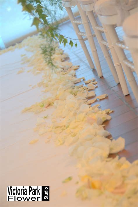 Wedding Aisle Lined With White Rose Petals