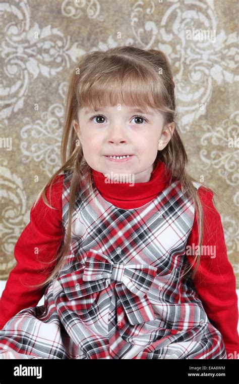 Beautiful Little Girl Posing For Camera In Studio Stock Photo Alamy