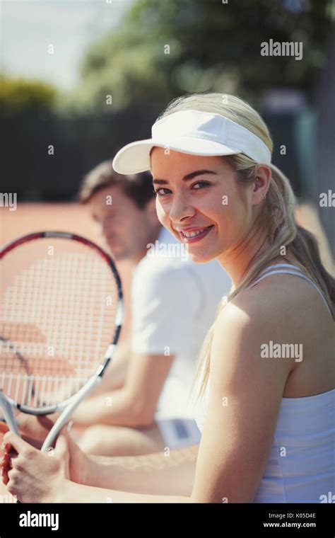 Portrait Smiling Confident Young Female Tennis Player Holding Tennis