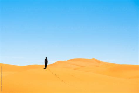 Traveler Walks In Desert In Morocco By Stocksy Contributor Alexander