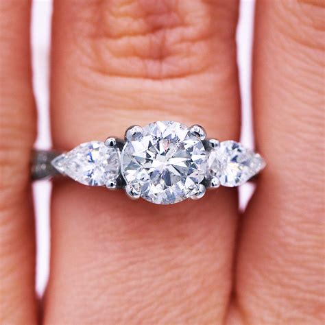 157 Ct Round Diamond Engagement Ring With Pear Shape Side