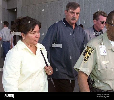 Sandy Murphy Left And Her Husband Kenneth Murphy Are Escorted From The Clark County