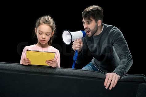Angry Father With Megaphone Screaming At Upset Daughter Using Digital