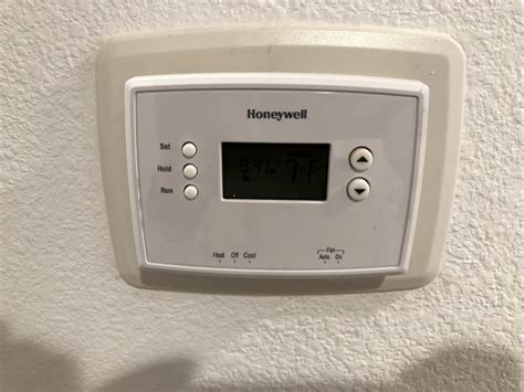If there is no screw, just use a flat head screwdriver to pry the cover off. How to remove the wall plate behind Honeywell thermostat ...