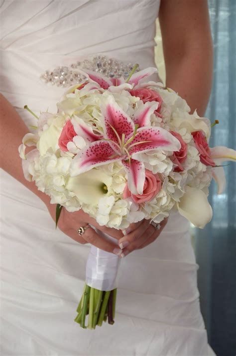 White Hydrangea White Calla Lilies Stargazer Lilies Coral Roses