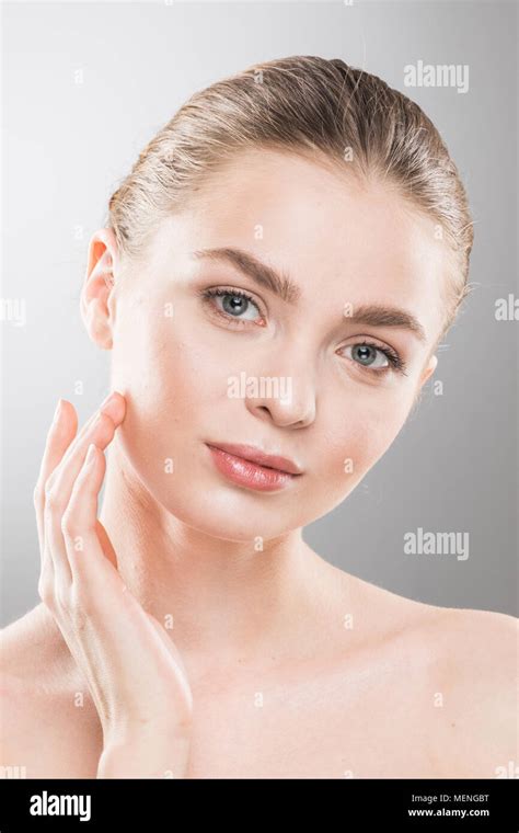 Beautiful Young Woman With Clean Fresh Skin Touch Own Face Facial