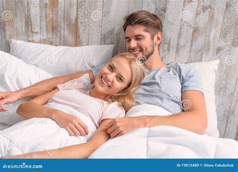 Cute Loving Couple Embracing In Bedroom Stock Image Image Of Happy