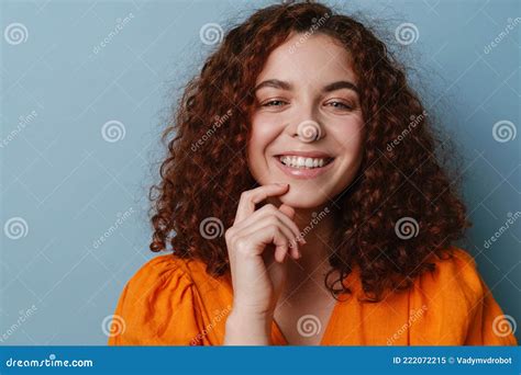 Happy Redhead Curly Girl Smiling And Looking At Camera Stock Image