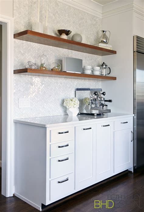 Floating kitchen shelves aren't cabinets, but they do provide some storage. Coffee Bar with Herringbone backsplash and floating ...