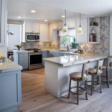 These kitchen layouts with peninsula might represent the revolution you need to give to your kitchen when you decide to redesign and renovate it according to your taste and needs. Colorful Kitchen design with blues, grays and white ...