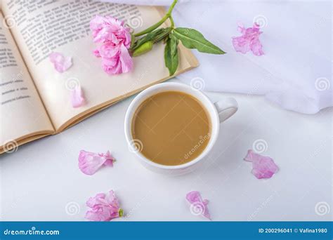 Romantic Vintage Still Life With Pink Flowers Old Book Cup Of Tea Or