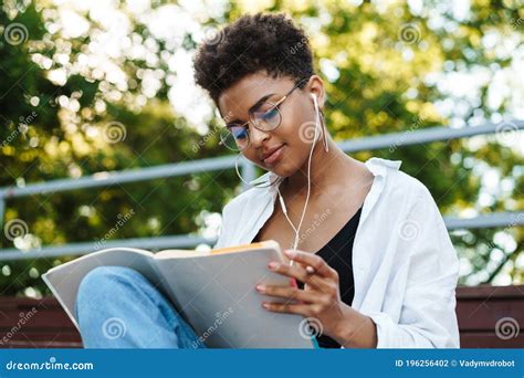 African Woman Reading Book Stock Photo Image Of Listening 196256402