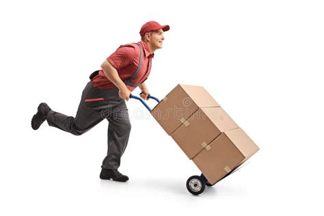 Mover Running And Pushing A Hand Truck Loaded With Boxes Stock Photo