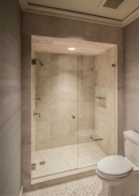 The subject of whether the toilet paper should go over or under the roll has been a debate since time immemorial. Frameless shower by Dauphin with toilet paper holder ...