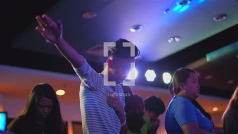 Raised Hands During A Worship Service — Video — Lightstock