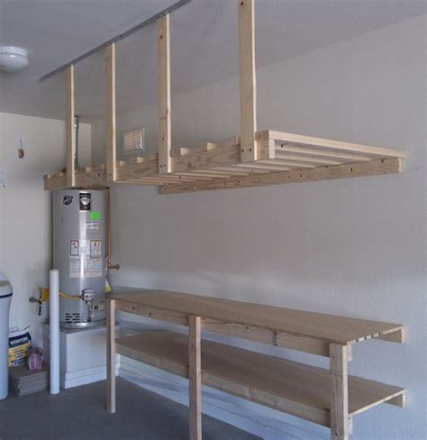 For example, a salvaged wood panel can be used as a pegboard or may be cut into several pieces and converted into shelves. Garage-Ceiling-Storage-DIY.jpg | Garage work bench, Garage ...