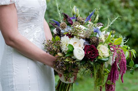 Send refreshing blooms, even from afar. Delphinium, Ranunculus, and Garden Rose Bridal Bouquet ...