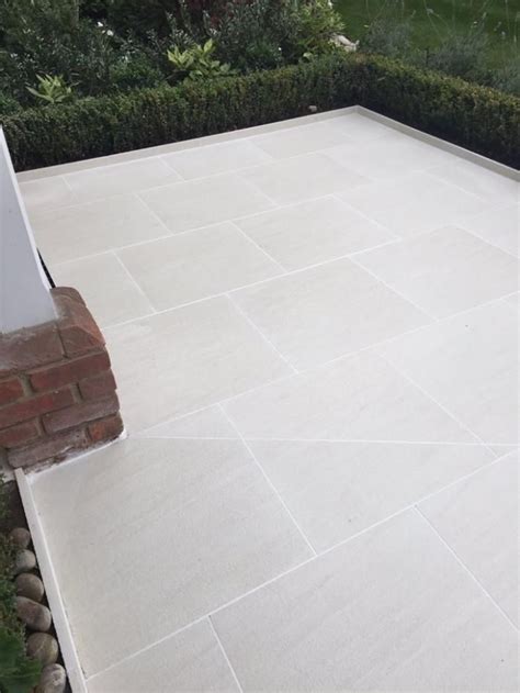 Standard concrete paver base installation. Sandy White Porcelain Paving | Patio tiles, Patio slabs ...