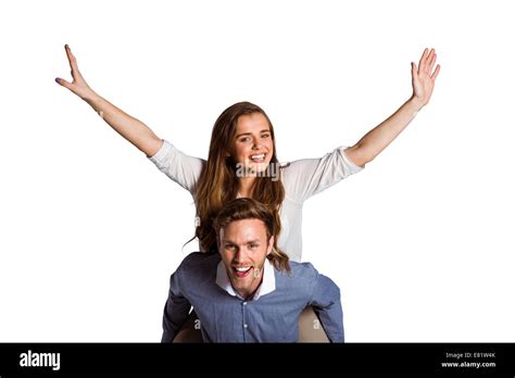 Smiling Young Man Carrying Woman Stock Photo Alamy