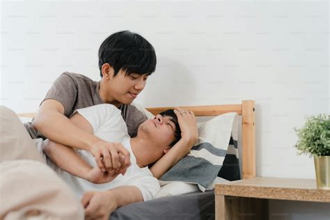 Asian Gay Couple Kiss And Hug On Bed At Home Young Asian Lgbtq Men Happy Relax Rest Together