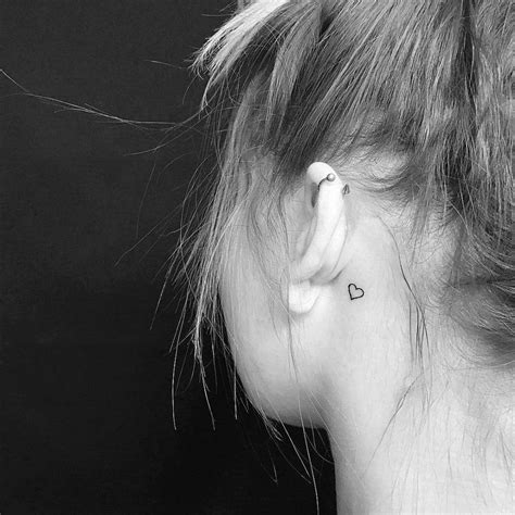 Minimalist Heart Outline Tattoo Behind The Left Ear