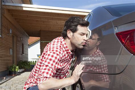 Germany Bavaria Nuremberg Mature Man Kissing Car Photo Getty Images