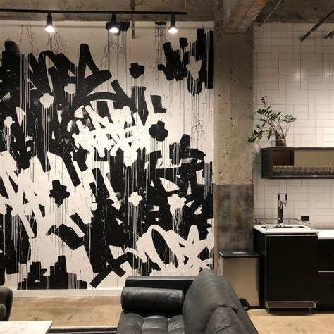 A Black And White Abstract Graffiti Tag Mural In A Production Offices